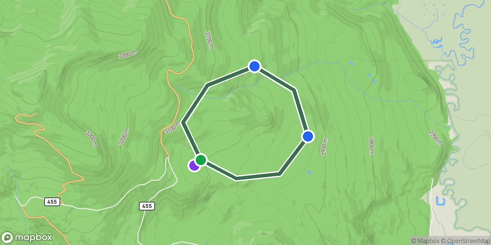 Example trip route drawn as a loop on a terrain map, with markers for the start, two overnight stops, and the trailhead parking area